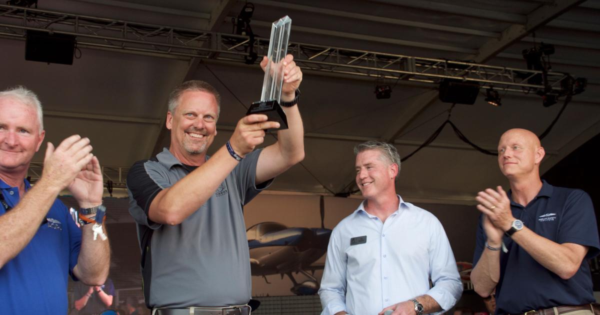 Cirrus co-founder and chairman Dale Klapmeier accepts the Joseph T. Nall Safety Award Sunday from the AOPA Air Safety Foundation. (Photo: Mark Huber)