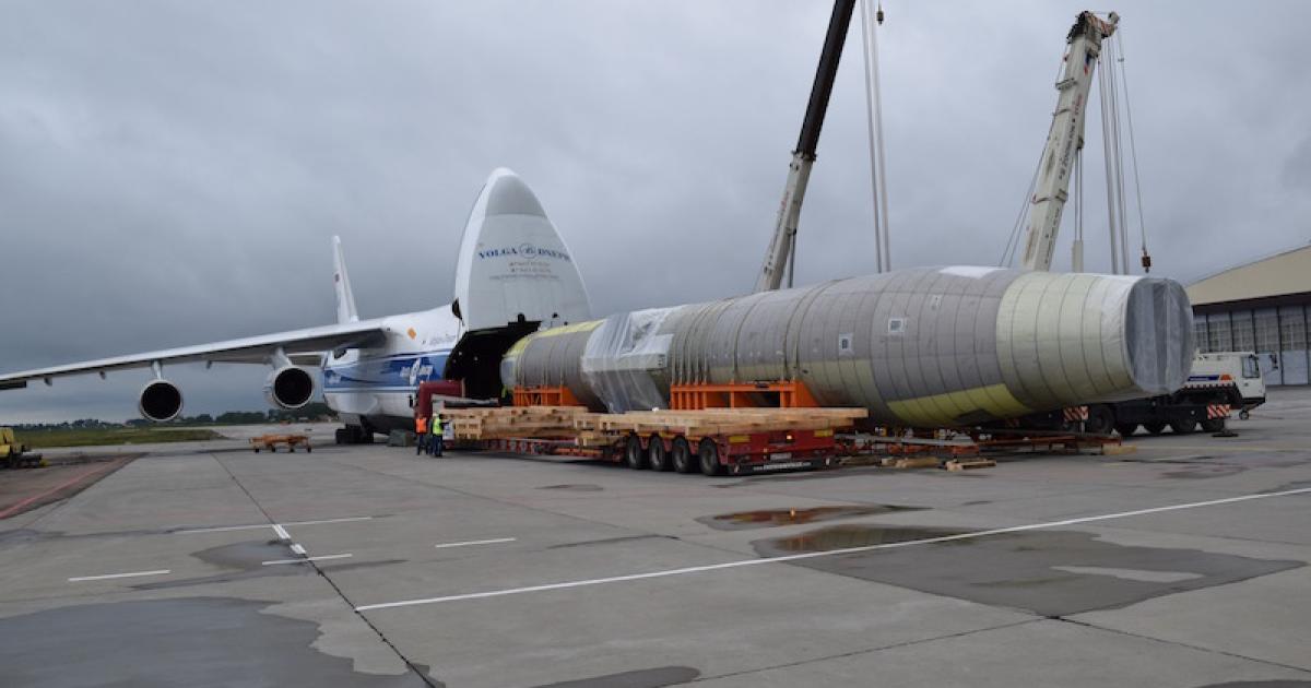The MC-21 static test airframe emerges from an An-124 freighter outside the Central AeroHydrodynamic Institute (TsAGI) in Moscow. (Photo: UAC)