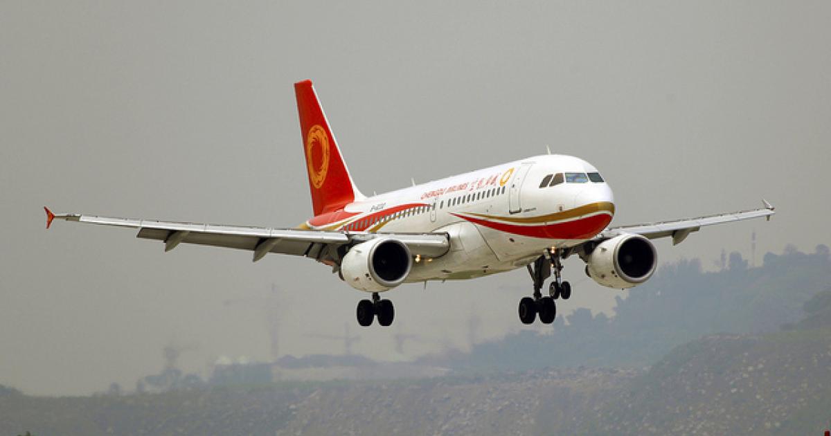 A Chengdu Airlines Airbus A319 approaches Chongqing Jianbei International Airport. Some 80 percent of Chengdu Airlines’ pilots train in the U.S., Australia and Europe. (Photo: Flickr: <a href="http://creativecommons.org/licenses/by-sa/2.0/" target="_blank">Creative Commons (BY-SA)</a> by <a href="http://flickr.com/people/byeangel" target="_blank">byeangel</a>)