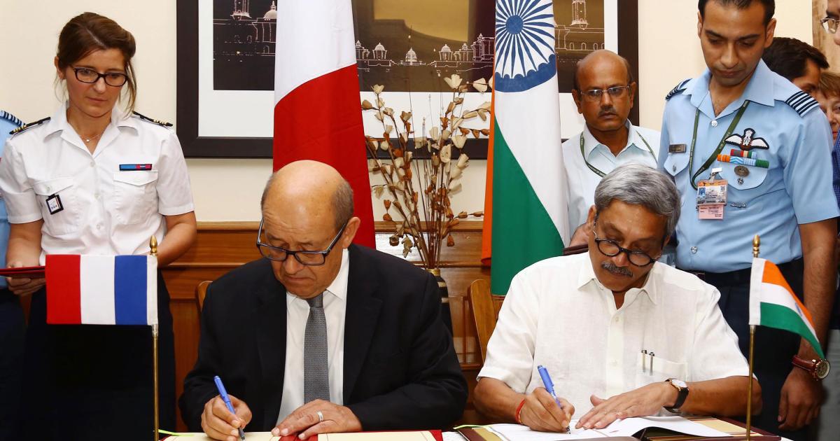 French Defence Minister Yves Le Drian (left) signed the inter-governmental agreement on the Rafale with Indian Defence Minister Manohar Parrikar.