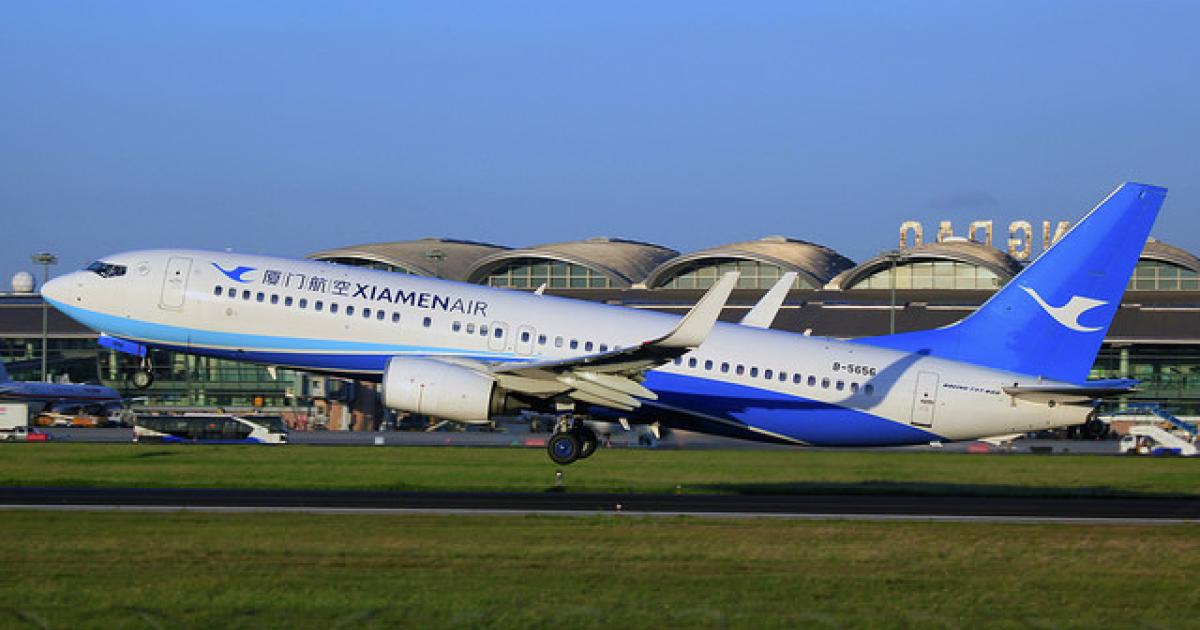 A Xiamen Airlines Boeing 737-800 takes off from Qingdao Liuting International Airport. (Photo: Flickr: <a href="http://creativecommons.org/licenses/by-sa/2.0/" target="_blank">Creative Commons (BY-SA)</a> by <a href="http://flickr.com/people/byeangel" target="_blank">byeangel</a>)