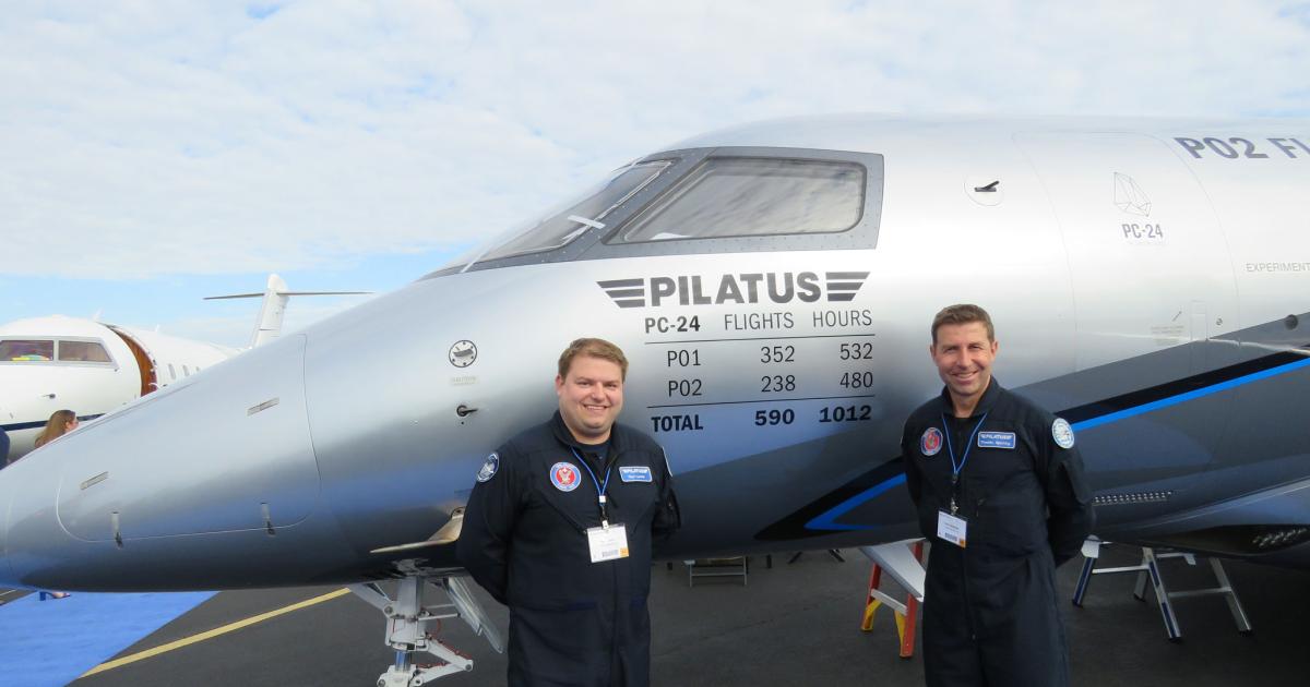  Flight-test engineer Guy Lynch, left, and test pilot Theddy Spichtig are on the static display with the PC-24 today only.
