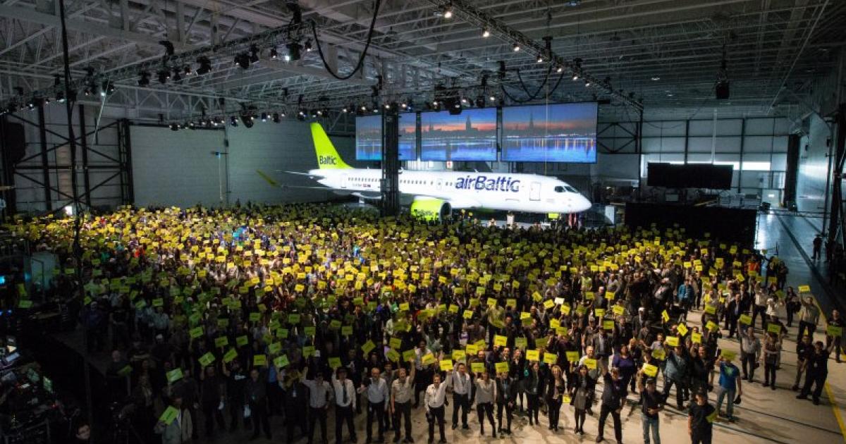 Bombardier employees and executives join Air Baltic representatives and government officials to celebrate the first delivery of the CS300. (Photo: Bombardier)