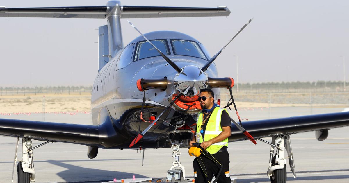 This Pilatus PC-12 single-engine turboprop is being maneuvered to its static display parking spot at MEBAA 2016 with a Mototok wireless aircraft tug. Amac Aerospace is the Middle East distributor for the PC-12 and other popular business aircraft types.