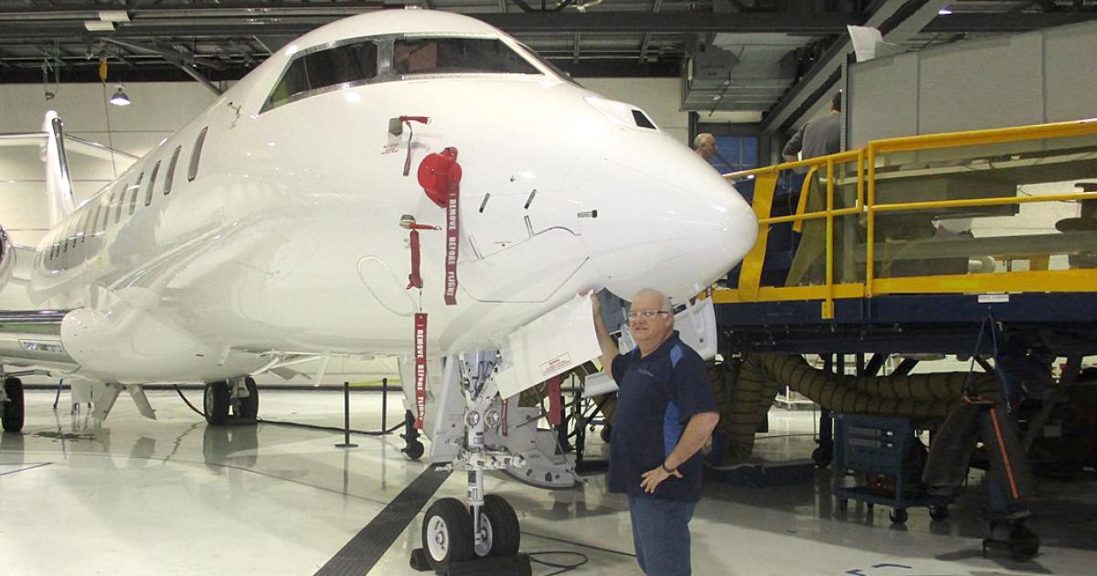 Brent Davies, Zenith Jet's director of technical services stands before the company's 100th supervised Bombardier Global project to be completed since its inception in 2008.  The brand new Global 6000 is slated to be delivered on Dec. 23, after the correction of some minor discrepancies noted during the pre-delivery inspection.