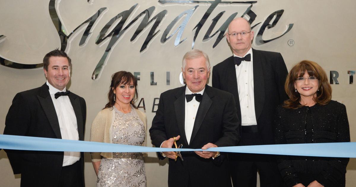 Flanking BBA Aviation chairman Sir Nigel Rudd as he cut the ribbon formally opening Signature's new London Luton FBO complex were: (l-r) Daniel Myles, director of Signature Luton; Evie Freeman, managing director of Signature Flight Support EMEA; BBA Aviation CEO Simon Pryce; and Maria Sastre, Signature's president and COO.
