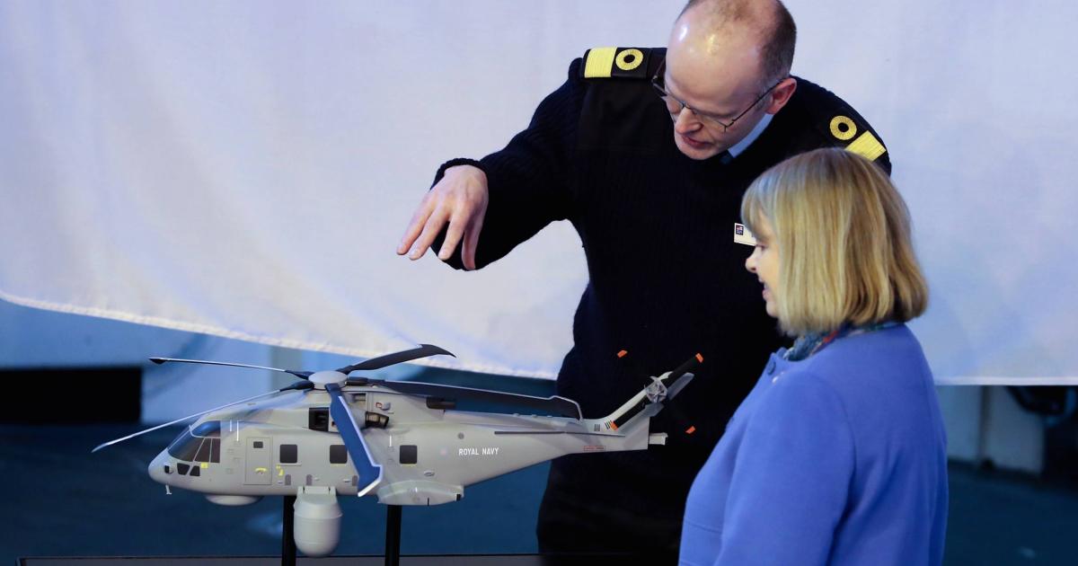 Harriett Baldwin, the UK Minister for Defence Procurement, is shown a model of a Royal Navy Merlin HM.2 helicopter fitted with the Crowsnest system (photo: MOD Crown Copyright 2017)