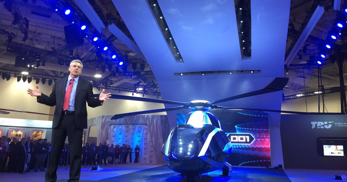 Bell Helicopter president and CEO Mitch Snyder unveils a mockup of the company's FCX-001 concept helicopter on the opening day of Heli-Expo 2017. The FCX-001 will be used to test future rotorcraft technologies and methods of implementing them. (Photo: Mariano Rosales/AIN)