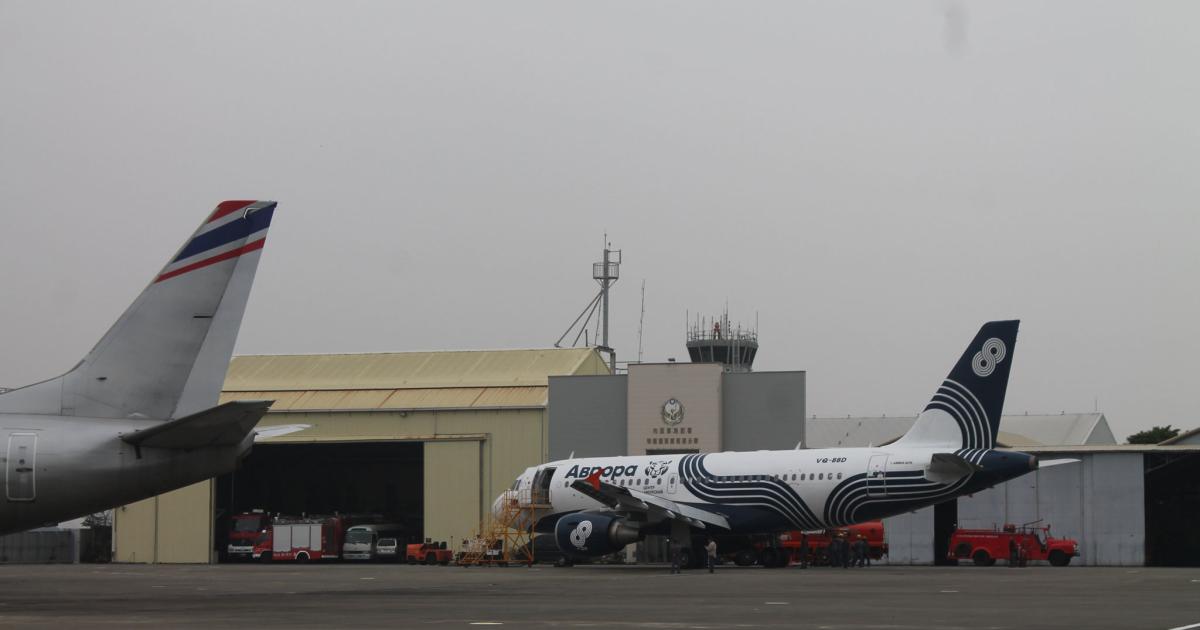A Boeing 737 belonging to Orient Thai Airlines and an Airbus A319 from Russian Far East carrier Aurora, on the ramp at Air Asia’s Tainan facility. (Photo: Chris Pocock)