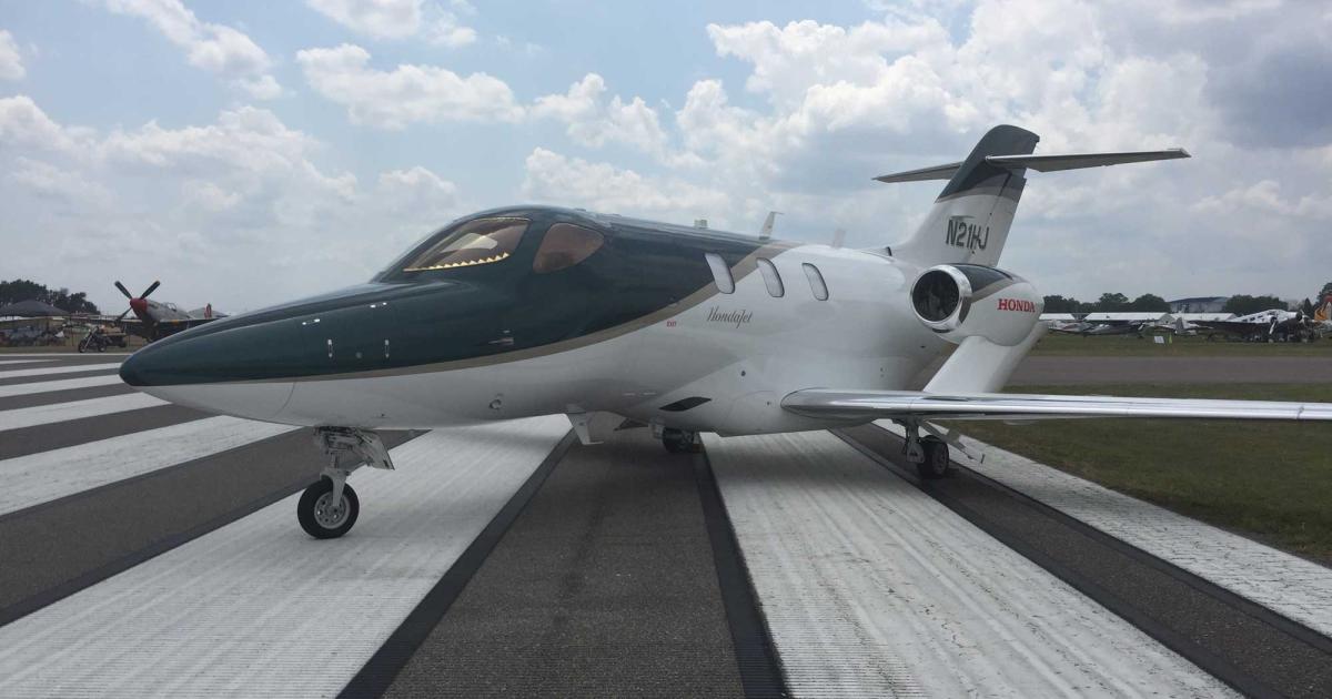 HondaJet N21HJ, which has a British racing green finish, is drawing crowds this week at the Sun ’n’ Fun International Fly-In in Lakeland, Florida. The jet is making its debut at the airshow, as well as participating in the afternoon aerial display. (Photo: Chad Trautvetter/AIN)