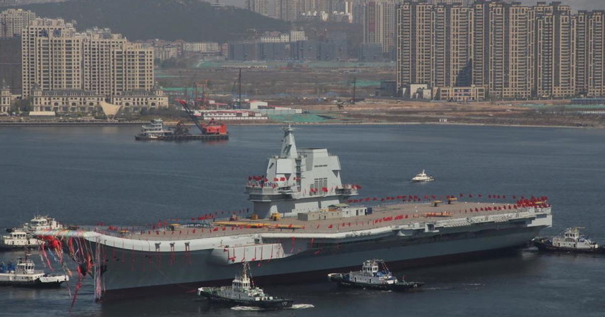 The Type 001A carrier was towed out from the dry dock at Dalian on April 26. (Photo: Chinese Internet, Xinhua News Agency)