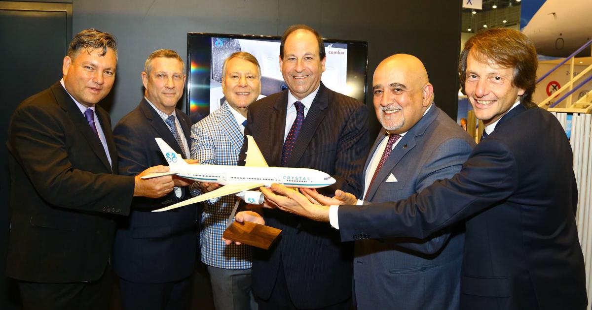 Celebrating the management and operating agreement for the Crystal AirCruises Boeing 777 are (l to r): Edwin F. Kelly, director, Aruba Department of Civil Aviation; Greg Laxton, president, Boeing Business Jets; Jorge Colindres Marinakis, chairman and founder, The Registry of Aruba; Richard Ziskind, vp and managing director, Crystal AirCruises; Richard Gaona, chairman and CEO, Comlux; and Andrea Zanetto, CEO, Fly Comlux.