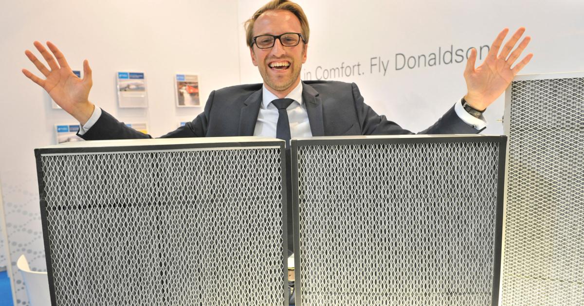Donaldson Aerospace (Hall 2B, E105) is exhibiting its two-stage Air Purification System (APS) cabin filters for the Boeing 737, 757, 777 and the Airbus A330. The company’s APS product line, pictured below with company sales manager Maximilien Legros, combines a HEPA particulate filter with a chemical-adsorbing carbon stage and is standard on the 787. Donaldson also has a retrofit APS product for the Airbus A320.