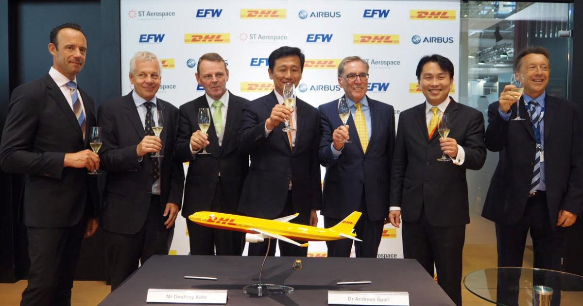 Celebrating Monday’s signing of an agreement to convert passenger-configured Airbus A330-300s for all-cargo operations were (from left) senior v-p of global network management, DHL Express, Dr. Joerg Andriof; senior v-p of global air fleet management, DHL Express, Geoffrey Kehr; guest-of-honor chief of the Saxon State Chancellery and state minister for federal and European affairs Dr. Fritz Jaeckel; guest-of-honor Singapore’s second minister for defence Ong Ye Kung; president & CEO of EFW Dr. Andreas Sperl; president & CEO of ST Engineering Vincent Chong and executive v-p of Europe, Africa and Pacific, Airbus, Christopher Buckley. The signing ceremony took place during opening day of the 2017 International Paris Air Show and is the second such agreement between the two companies. Work on the companies’ first agreement already is underway in Singapore. When the conversions are complete, they will include EASA and FAA supplemental type certifications.