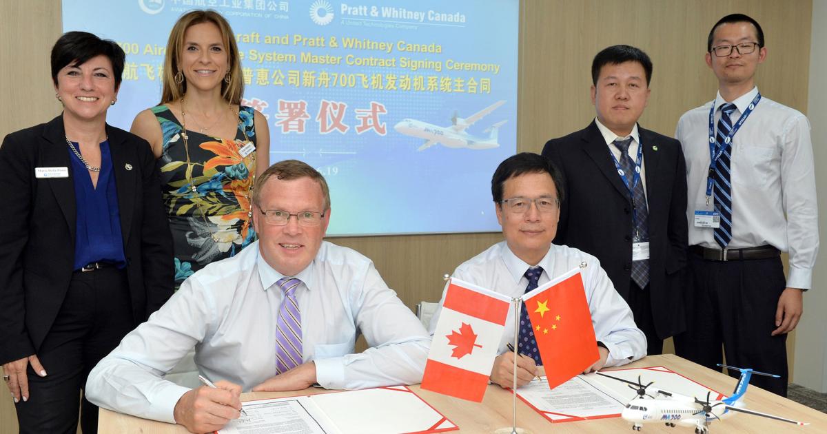 Pratt & Whitney Canada president John Saabas (l) and AVIC Aircraft chairman Chen Fu Sheng sign an agreement between the two companies to supply PW150Cs powerplants for the MA700 medium-range regional turboprop.