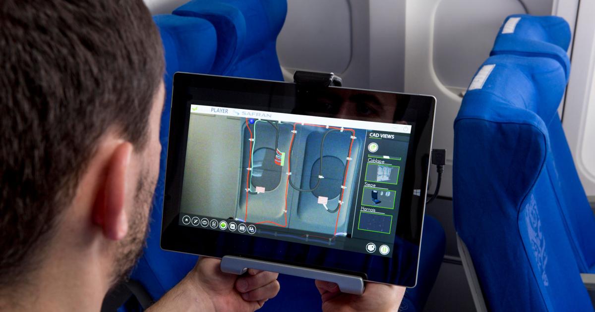 The two images above and at right depict Safran’s augmented reality technology being used to assist with complicated component assembly and airframe systems repair.