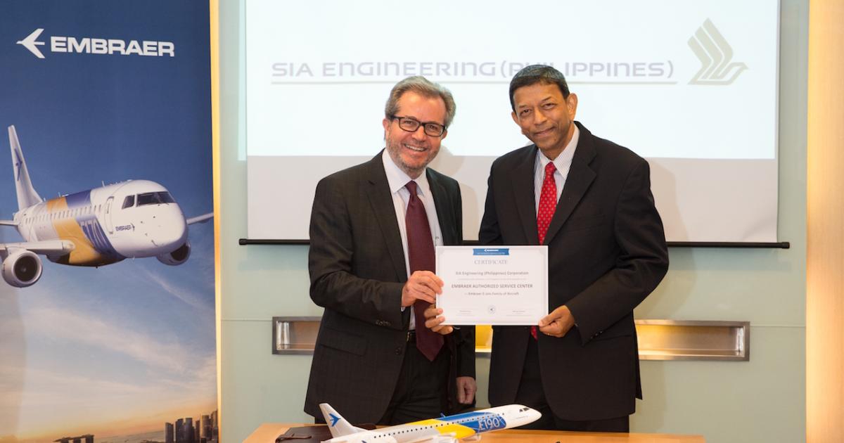 Ricardo Pesce, managing director of Embraer Asia-Pacific (left), and Mervyn Sirisena, chairman of SIAEP, celebrate the establishment of a new E-Jet service center in the Philippines. 