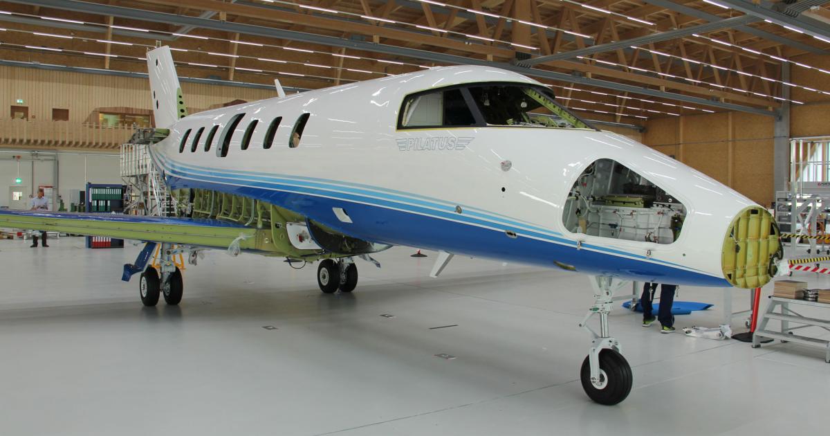 On July 12, the fuselage and wings of the first production PC-24 twinjet were mated at Pilatus Aircraft’s headquarters in Stans, Switzerland. Portsmouth, N.H.-based fractional provider PlaneSense is the launch customer for the new jet. (Photo: Pilatus Aircraft)