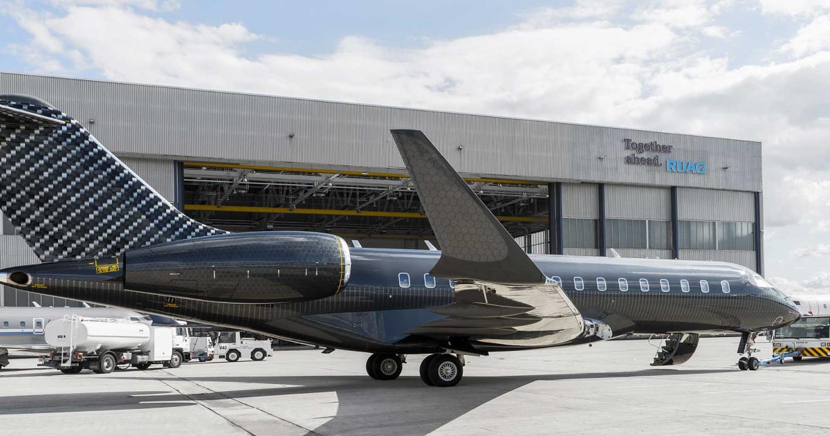 Happy Design Studios and Ruag teamed to repainted SBK Holding’s Bombardier Global Express XRS with a “Carboneum” design with "hand-painted, precise customization graphics highlighting the intricate patterns found in high performance, fiber-reinforced technology materials, such as carbon and honeycomb structures." (Photo: Ruag)