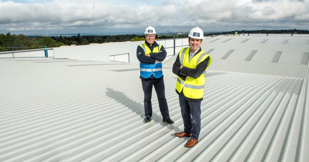 Robert Walters, foreground, business development director at London Biggin Hill Airport, surveys the airfield’s new hangar from the top down.