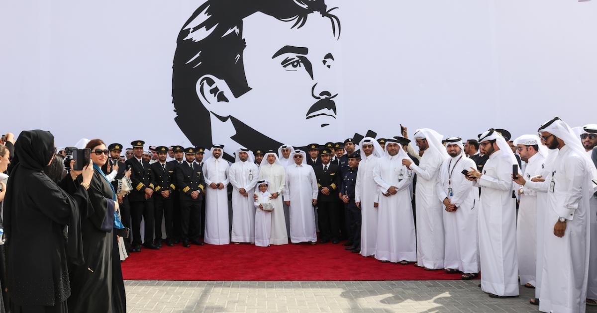 Akbar Al Baker (center, with child) leads a show of support for Sheikh Tamim bin Hamad Al Thani, Emir of Qatar, by Qatar Airways on July 13. (Photo: Qatar Airways)