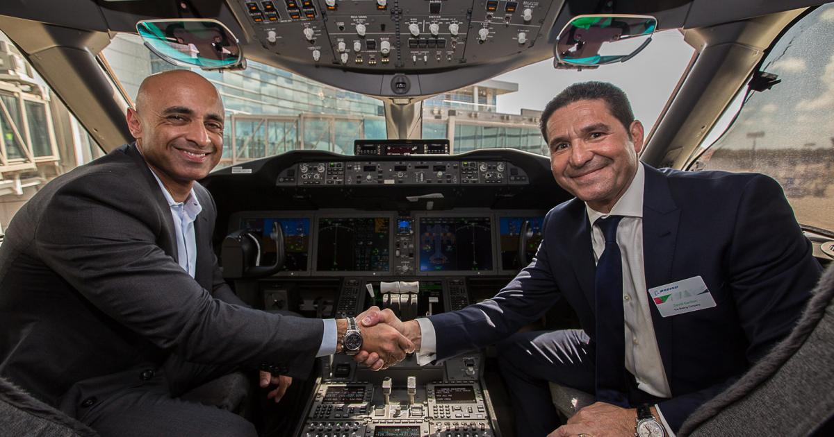 UAE ambassador to the U.S. Yousef Al Otaiba (left) sits with Boeing’s Charleston area vice president of operations and manufacturing, David Carbon, in the flight deck of a 787-10. (Photo: Embassy of the UAE)