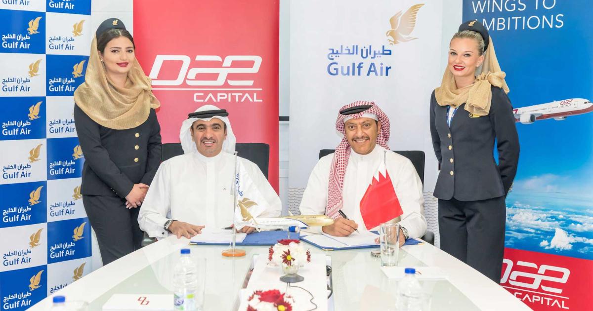 Khalifa Al Daboos, managing director of DAE (left) and Waleed Al Alawi, deputy CEO of Gulf Air, sign the agreement for Gulf Air to lease five Boeing 787-9 Dreamliners. 