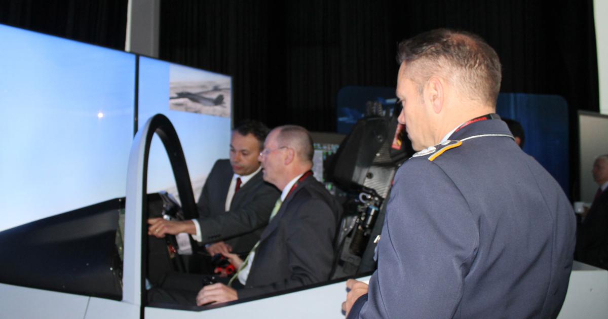 Lockheed Martin brought the F-35 cockpit demonstrator to The International Fighter Conference in Berlin. where Lt. Gen. Karl Muellner (below) revealed the German Air Force interest in acquiring the stealthy jet. (Photos: Chris Pocock) 