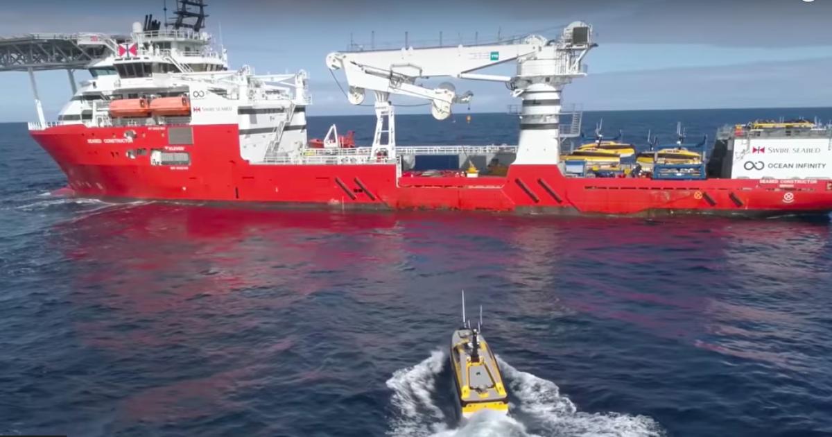 One of Ocean Infinity's unmanned surface vehicles (USVs) approaches the Seabed Constructor, the host ship conducting the new search. (Photo: Ocean Infinity) 
