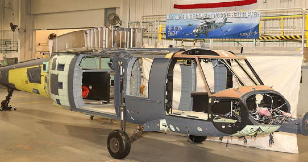 The airframe of the first HH-60W is seen in Sikorsky's Stratford works awaiting equipment. Note the nose mount for the forward-facing radar
