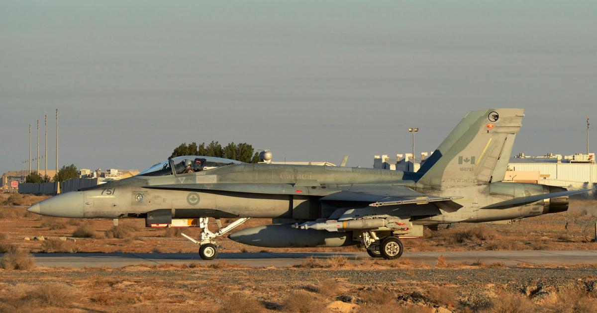 One of Canada's aging Hornets is seen in Kuwait during Operation Impact in 2014. (Photo: Royal Canadian Air Force)