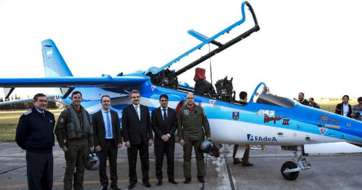 Argentina’s defense minister, Agustin Rossi (third from right), poses with EX-03, the first Pampa III, before the type’s first flight on Sept. 18, 2015. (Photo: FAdeA/TELAM)