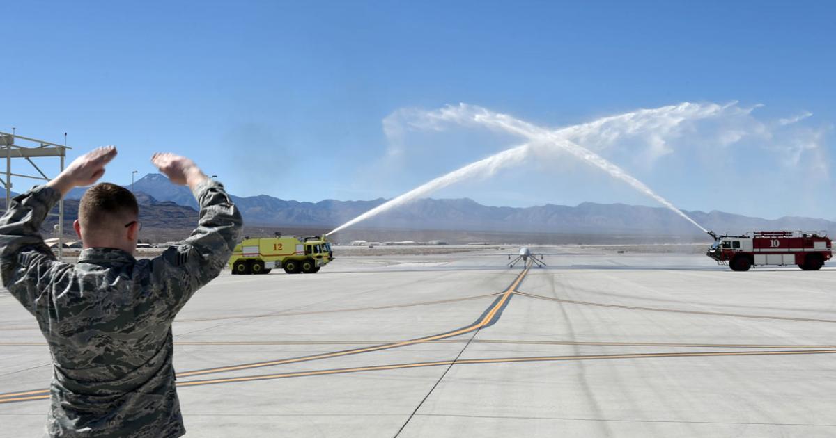 A water salute greets an MQ-1 Predator as it taxis in from the last local flight to be undertaken by the type from Creech AFB. (Photo: James Thompson/U.S. Air Force)