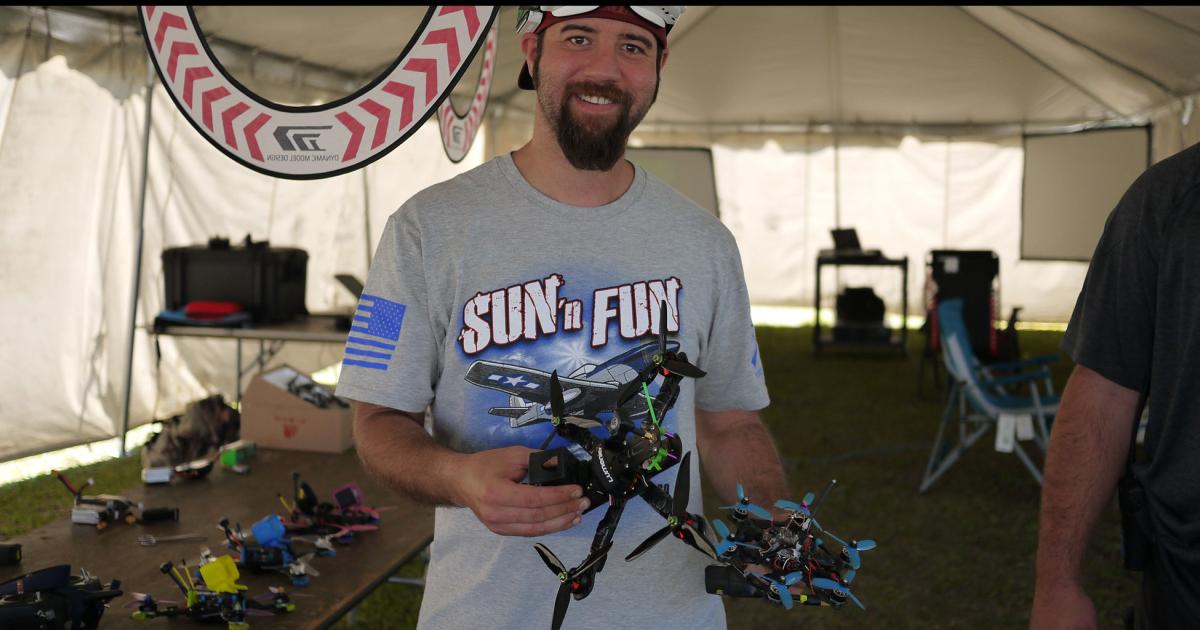 A volunteer demoed the FPV headset control of a drone on the Sun ‘n Fun drone race course.