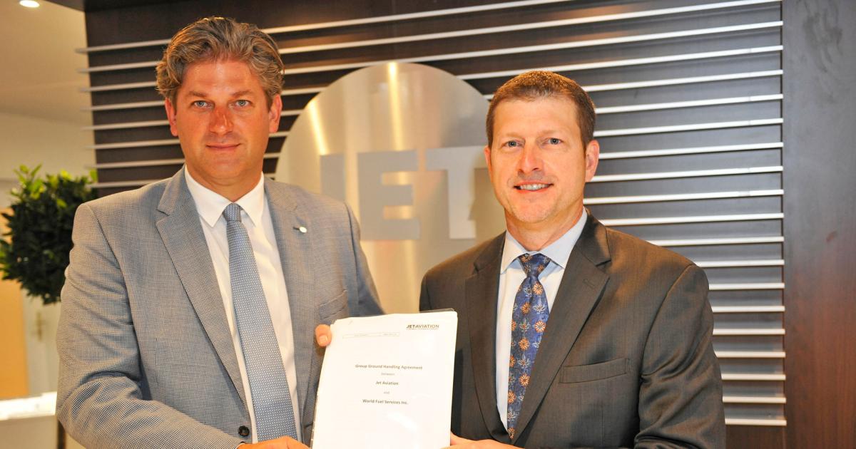Jet Aviation v-p of 
EMEA and Asia sales Oliver Burgsch and 
World Fuel Services/Colt senior v-p of global trip support Joel Purdom hail a deal that makes Jet Aviation the preferred FBO for World Fuel in EMEA and Asia. 