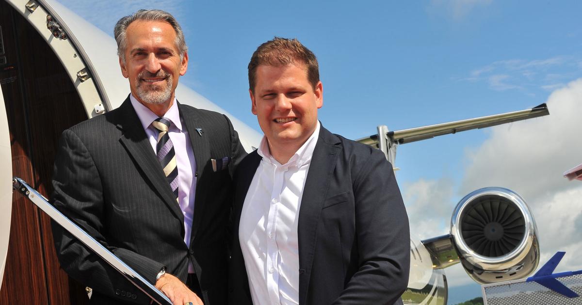 Air Hamburg orders more Embraer Legacy 650Es. L-R: Michael Amalfitano, president and CEO at Embraer Executive Jets, and Simon Ebert, partner, Air Hamburg.