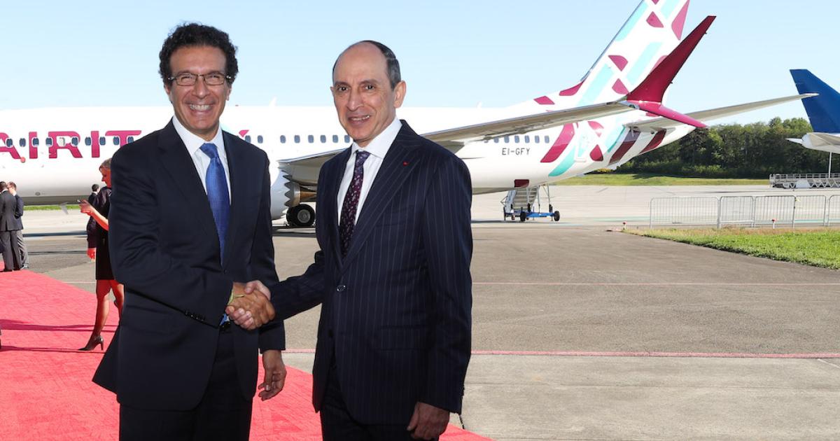 Boeing vice president of sales Ihssane Mounir (left) congratulates Qatar Airways CEO Akbar Al Baker on his acceptance of Air Italy's first Boeing 737 Max 8. (Photo: Boeing)