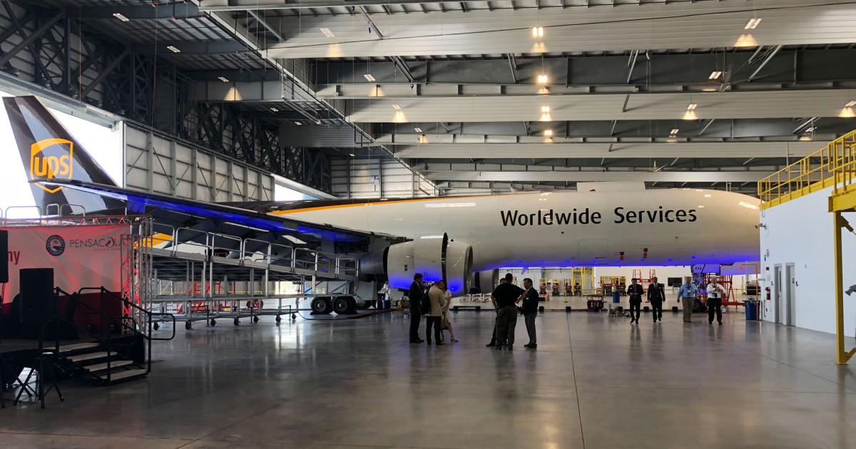 One of UPS’s Boeing 757 freighters stood on display with many of its wing access panels removed while it underwent a C-check during the grand opening of ST Engineering Aerospace's new 173,500-sq-ft MRO facility in Pensacola, Florida. UPS's fleet of seventy-five 757 freighters will be cycled through the facility for these inspections, with 21 to be performed there this year and 40 per year thereafter. (Photo: Chad Trautvetter/AIN)