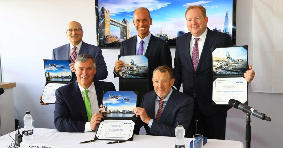 Signing the LOI were, left to right, David Joyce, GE Aviation; Kevin McAllister, Boeing Commerical Aircraft; Dennis Miullenburg, the Boeing Co.; Alexey Isaikin, Volga-Dnepr; and Stan Deal, Boeing Global Services.