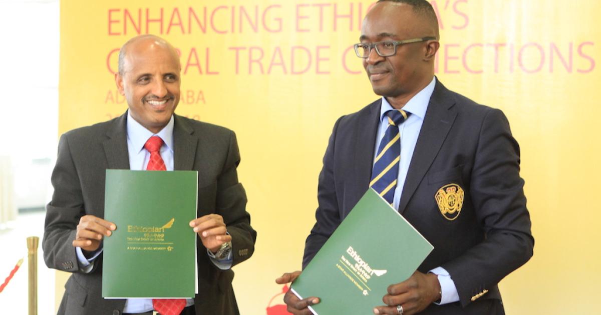 Ethiopian Airlines Group CEO  Tewolde GebreMariam (left) and DHL Global Forwarding Middle East and Africa CEO Amadou Diallo celebrate the consummation of their companies' new joint venture in Africa. 
