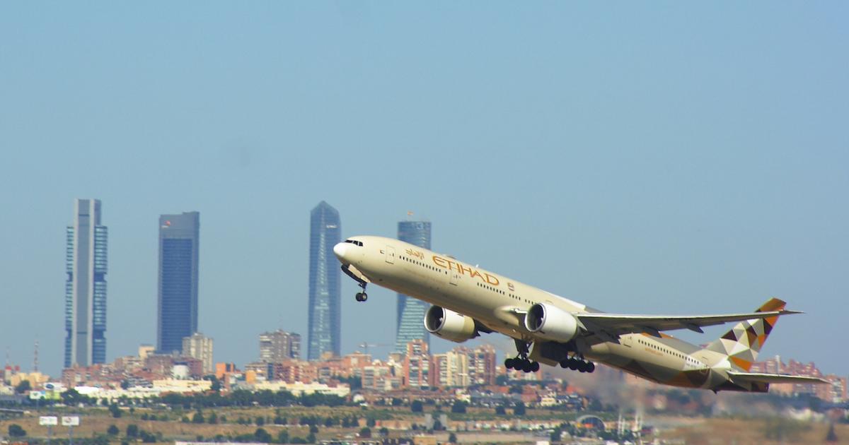 An Etihad Airways Boeing 777 takes off from Madrid Barajas International Airport. (Image: Flickr: <a href="http://creativecommons.org/licenses/by/2.0/" target="_blank">Creative Commons (BY)</a> by <a href="http://flickr.com/people/tigertrains" target="_blank">Tiger's transports</a>)