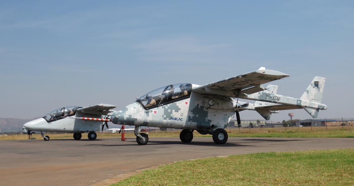 The two AHRLAC development aircraft (PDM on left, XDM in foreground) prepare to depart from the flight test facility at Wonderboom for the flight to the AAD show site at Waterkloof. (Photo: David Donald)