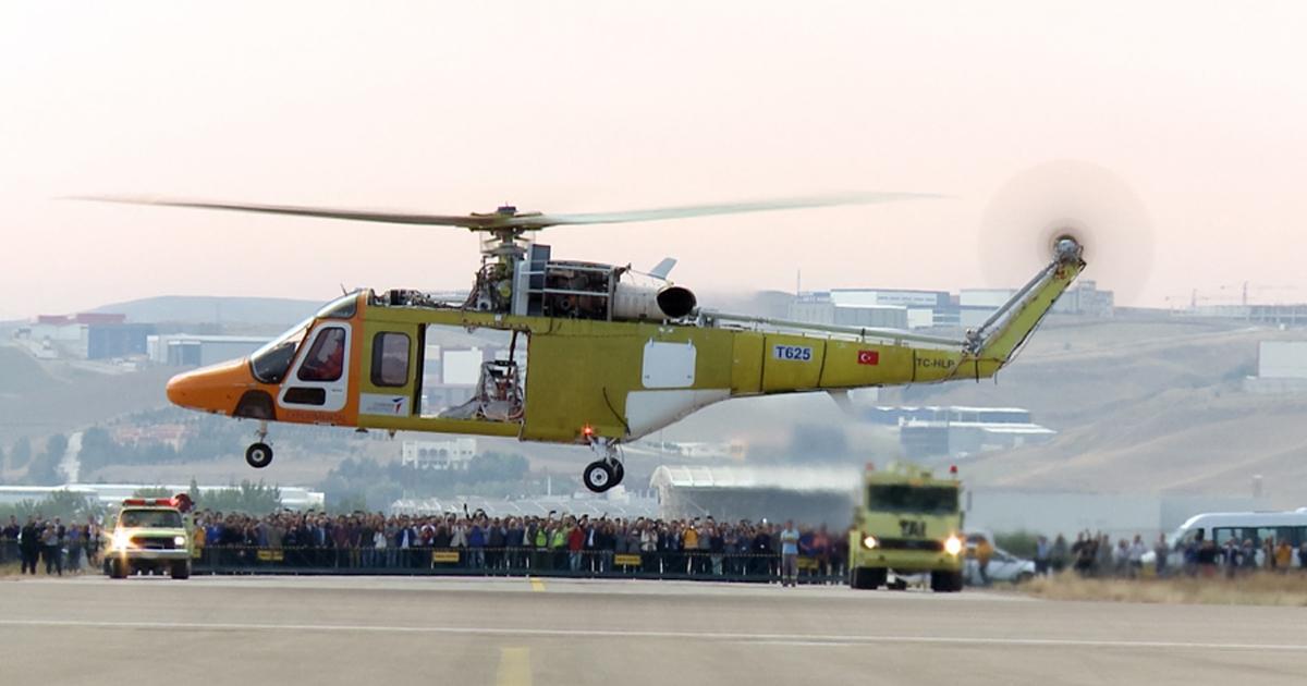 The first Turkish Aerospace T625 prototype is seen on its maiden hover flight on September 6 in front of a gallery of company employees and government officials. (photo: Turkish Aerospace)