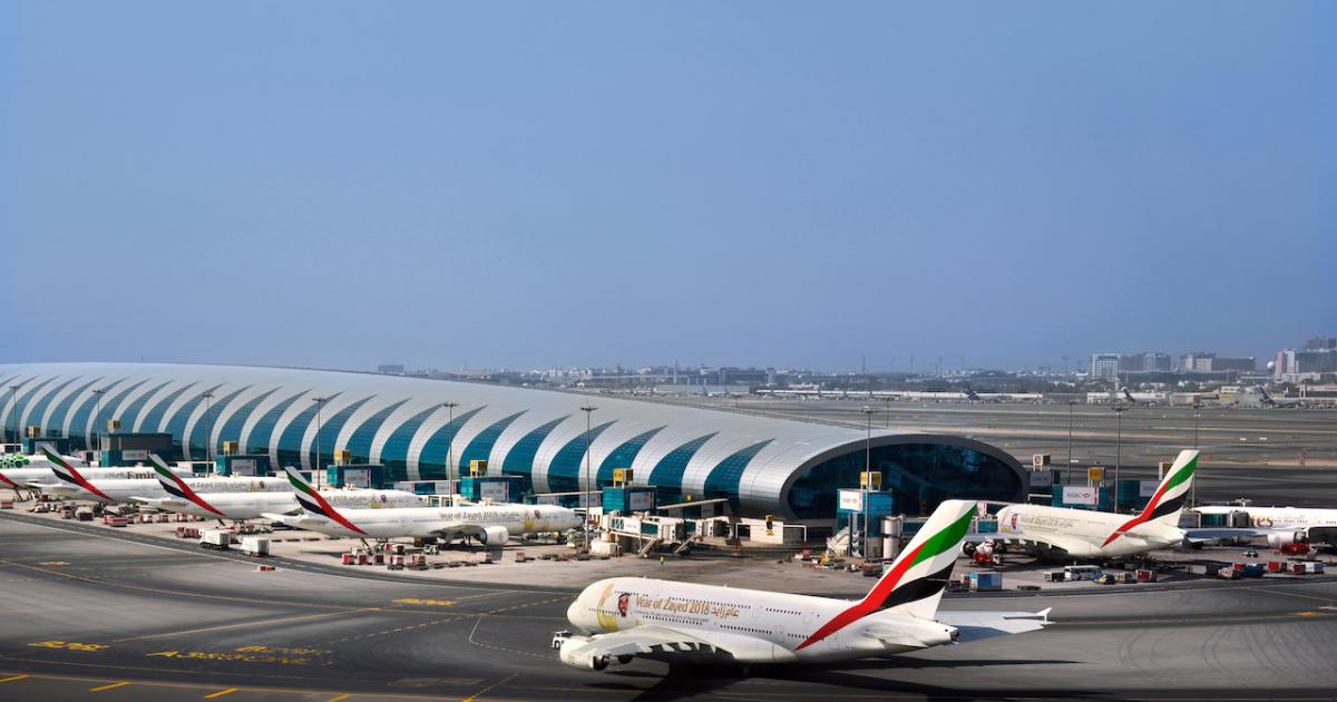 An Emirates A380 (foreground) taxies at a busy Dubai International Airport. (Photo: Emirates) 