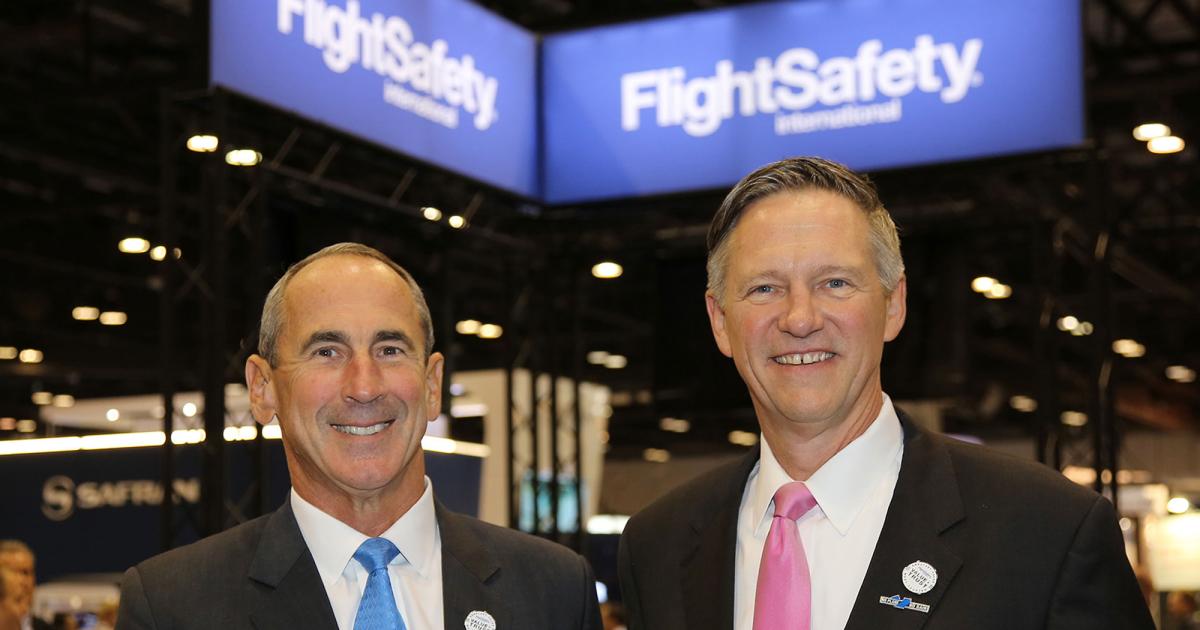 Ray Johns (l) and David Davenport were named to jointly succeed FlightSafety International’s late chairman, president, and CEO Bruce Whitman. Photo: Mariano Rosales