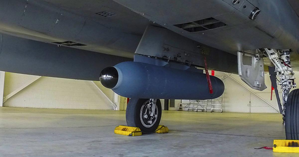 A development Legion Pod is seen on the centerline pylon of an F-15C Eagle. (photo: Lockheed Martin)