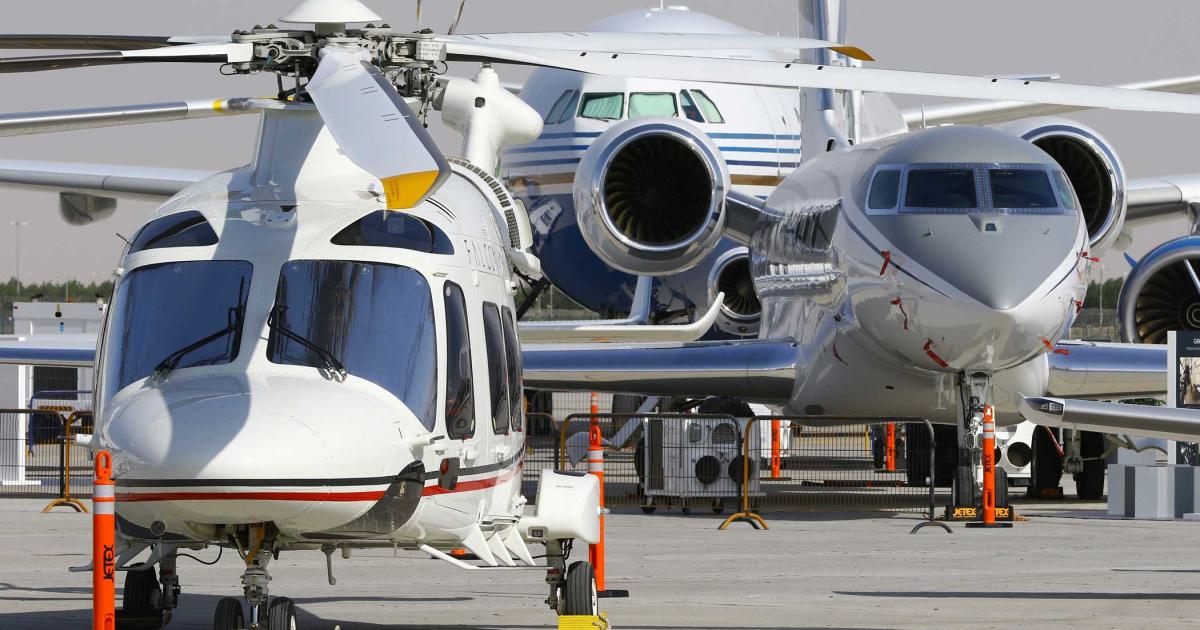 « This view of the packed static display area for the opening day of MEBAA 2018 has a little bit of everything. In the foreground at left is an Agusta A109SP twin-engine helicopter operated by Falcon Aviation. Behind and to the right is Gulfstream’s G600 demonstrator. In the background is the VVIP-configured Airbus A340-500 operated by casino magnate Sheldon Adelson’s Citadel Completions.