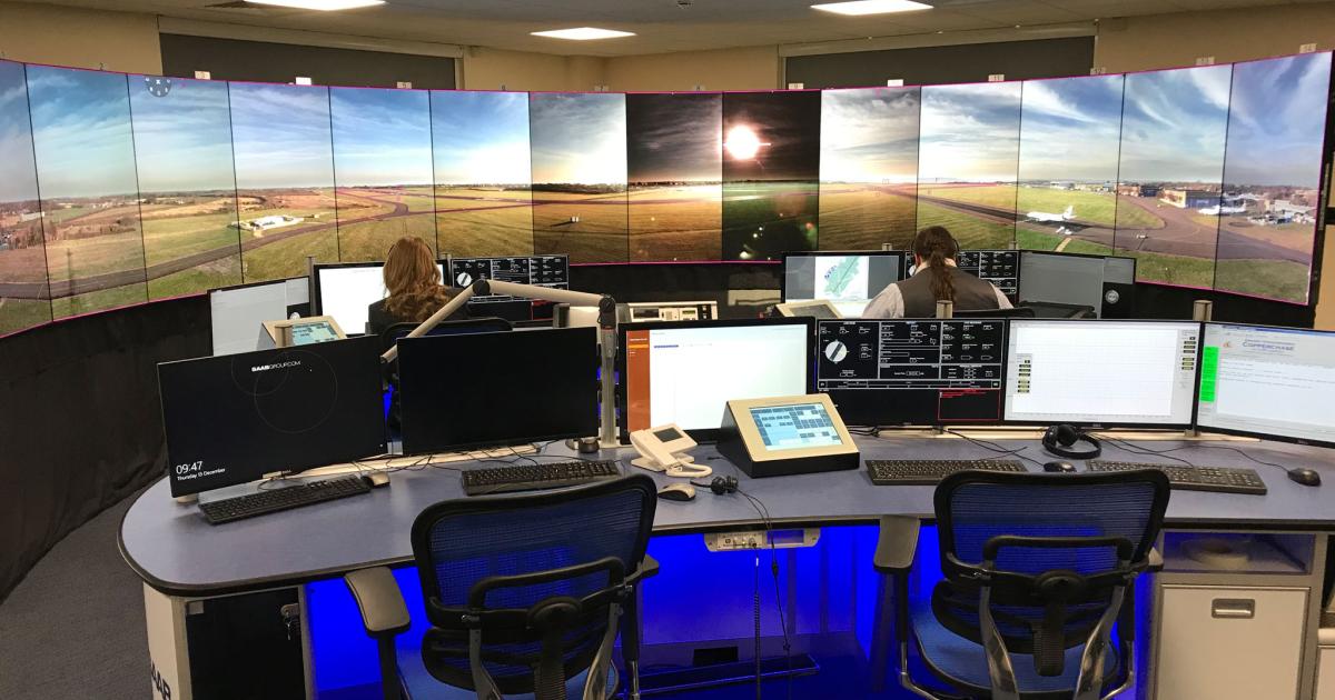 The Cranfield digital control center presents a 360-degree view of the airfield and its environs.  Note the dimming applied to two screens in the center to minimize the glare from the low winter sun. (Photo: David Donald)