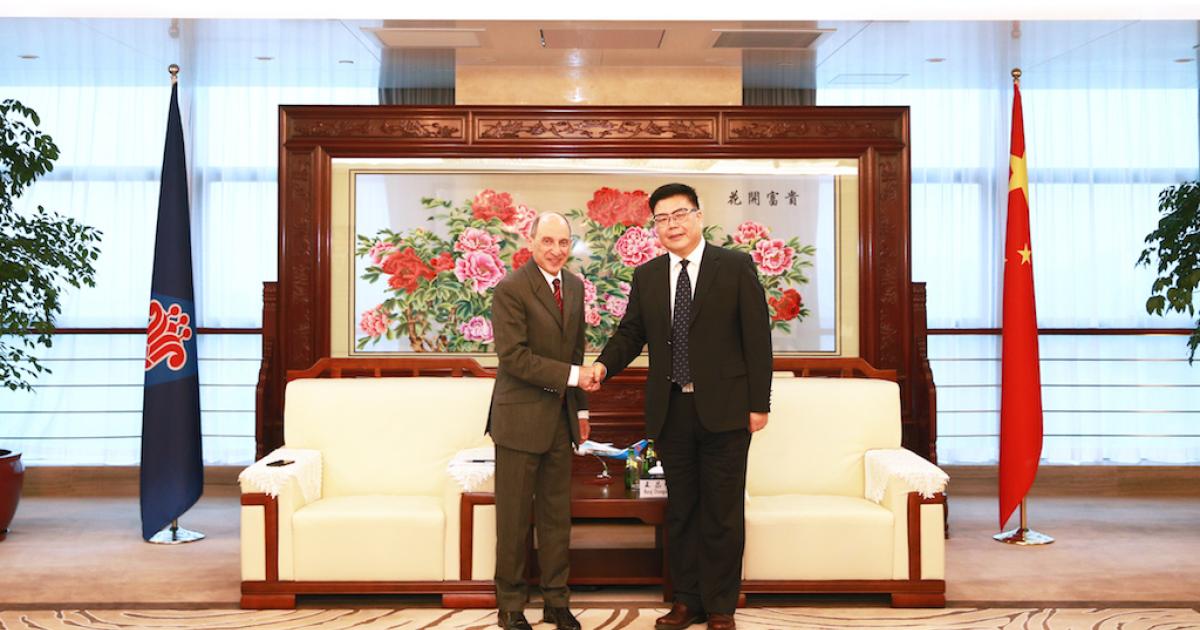 Qatar Airways CEO Akbar Al Baker, left, meets with China Southern Airlines chairman Wang Chang Shun to mark the Gulf airline's acquisition of a 5 percent stake in the Chinese carrier. (Photo: Qatar Airways) 