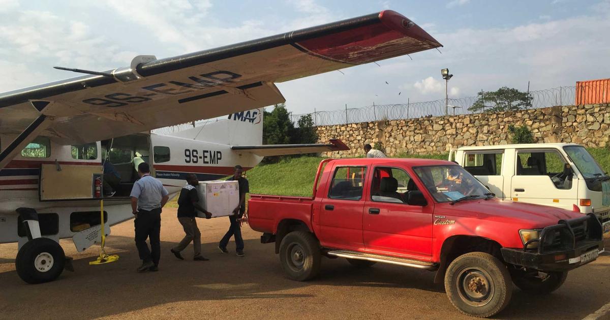 Workers unload vital medical supplies from an MAF Cessna Caravan in the North Kivu province of the Democratic Republic of the Congo as healthcare workers attempt to curb the outbreak of the Ebola virus disease. (Photo: David Petersen, Mission Aviation Fellowship)